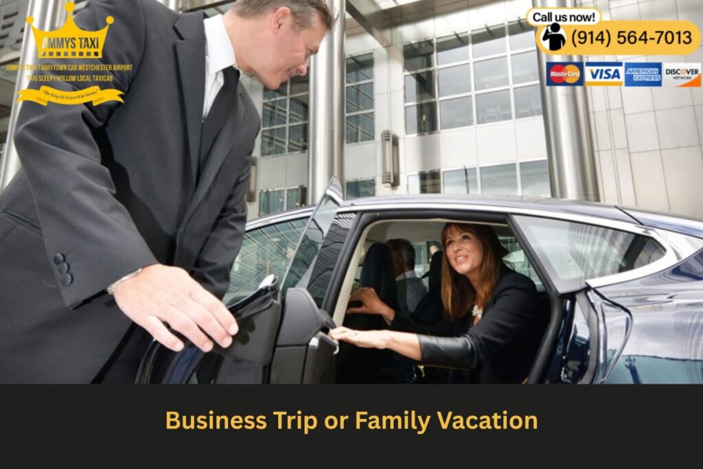 Passenger working on a laptop in the backseat of luxury vehicle