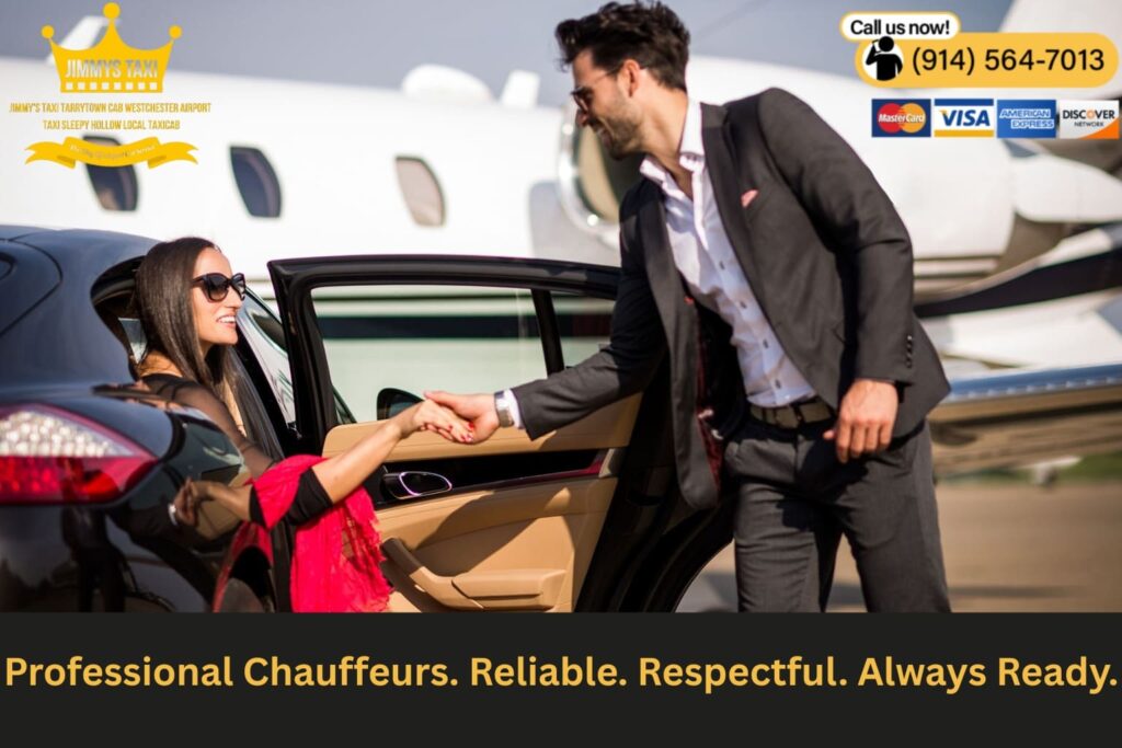 Chauffeur opening car door in front of airport terminal.