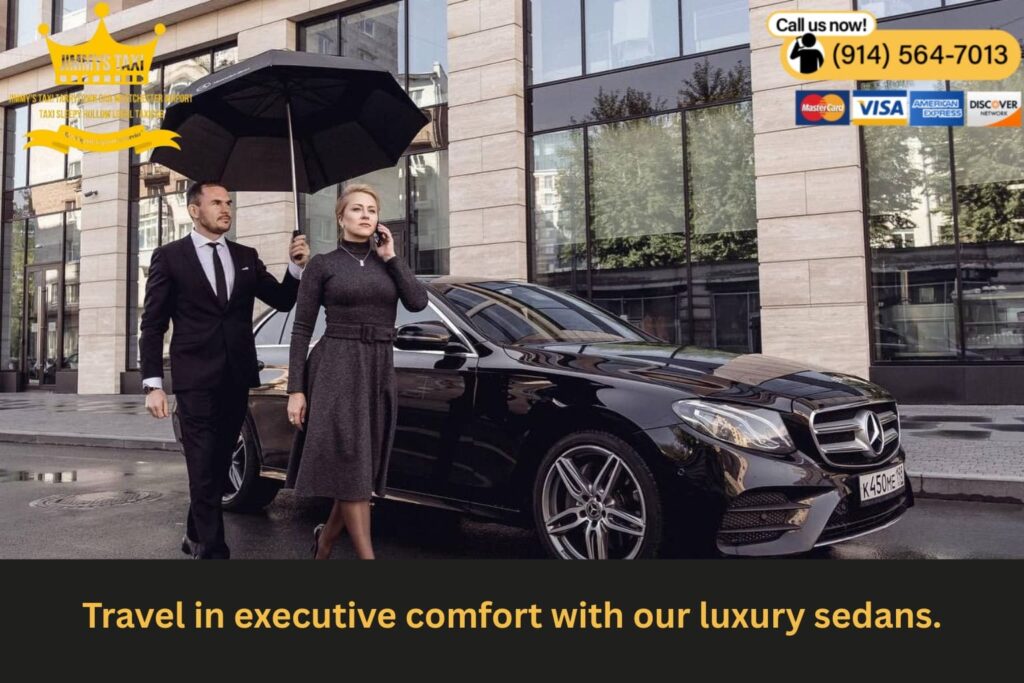 Luxury black sedan parked curbside at airport