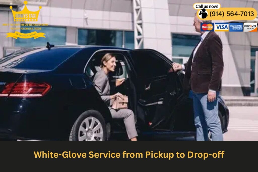 Driver opening car door for client in suit